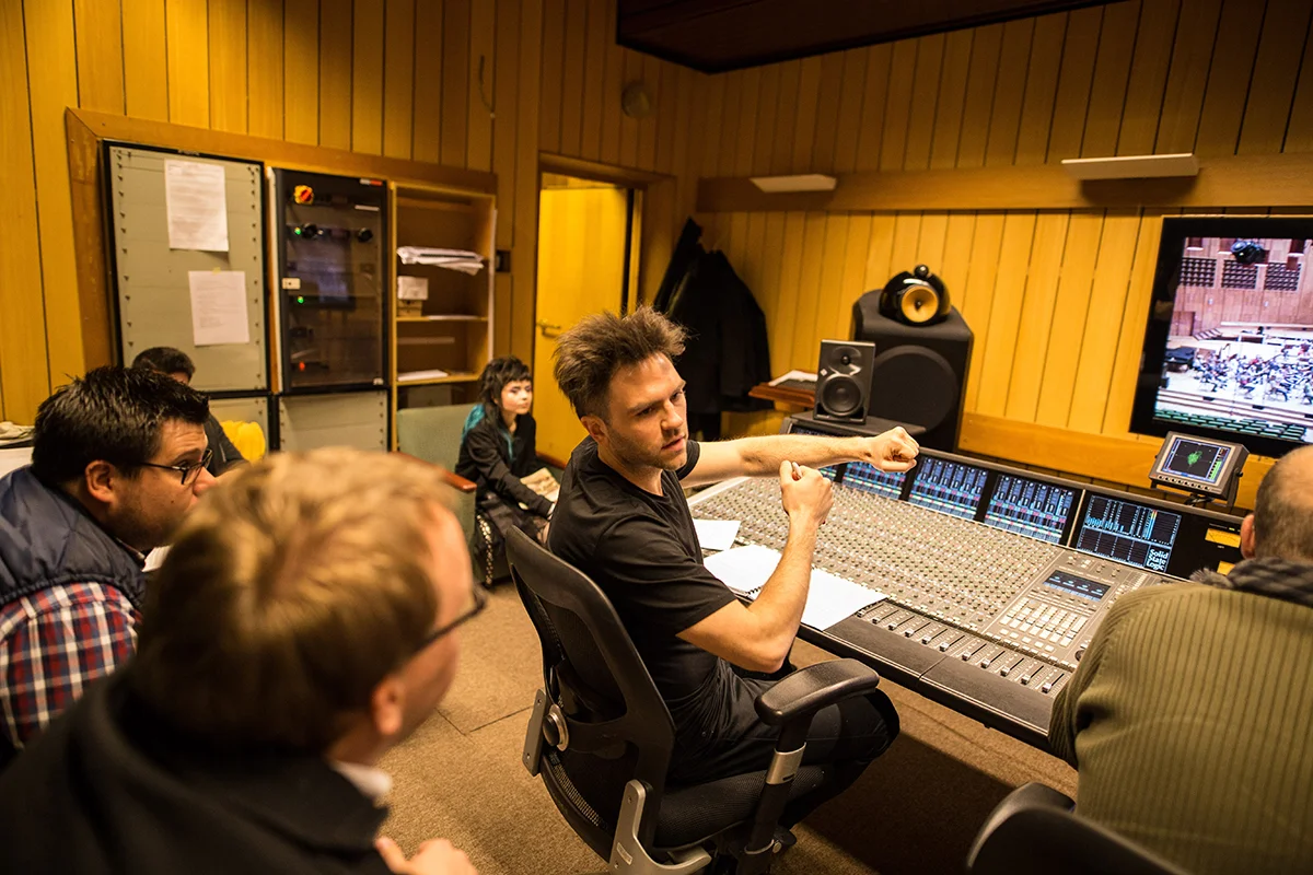 Krzysztof A. Janczak at the mixing desk with his team